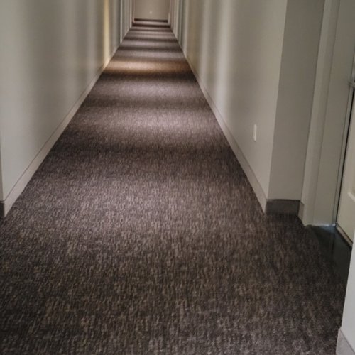 Hallway with carpeting by Carpets Galore