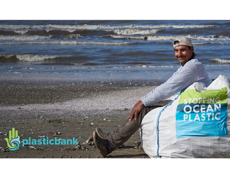 Plastic Bank Promotion by Mohawk featuring a man sitting on a beach