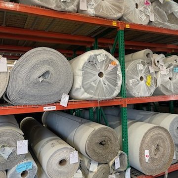 Carpets Galore flooring warehouse with rolls of carpet flooring